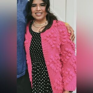 Pink heart sweater with pom-poms